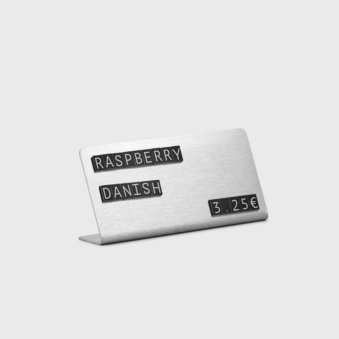 Close-up of tag in deli or refrigerated display:
Water-resistant stainless steel price tag with magnetic text – perfect for deli counters and cold displays