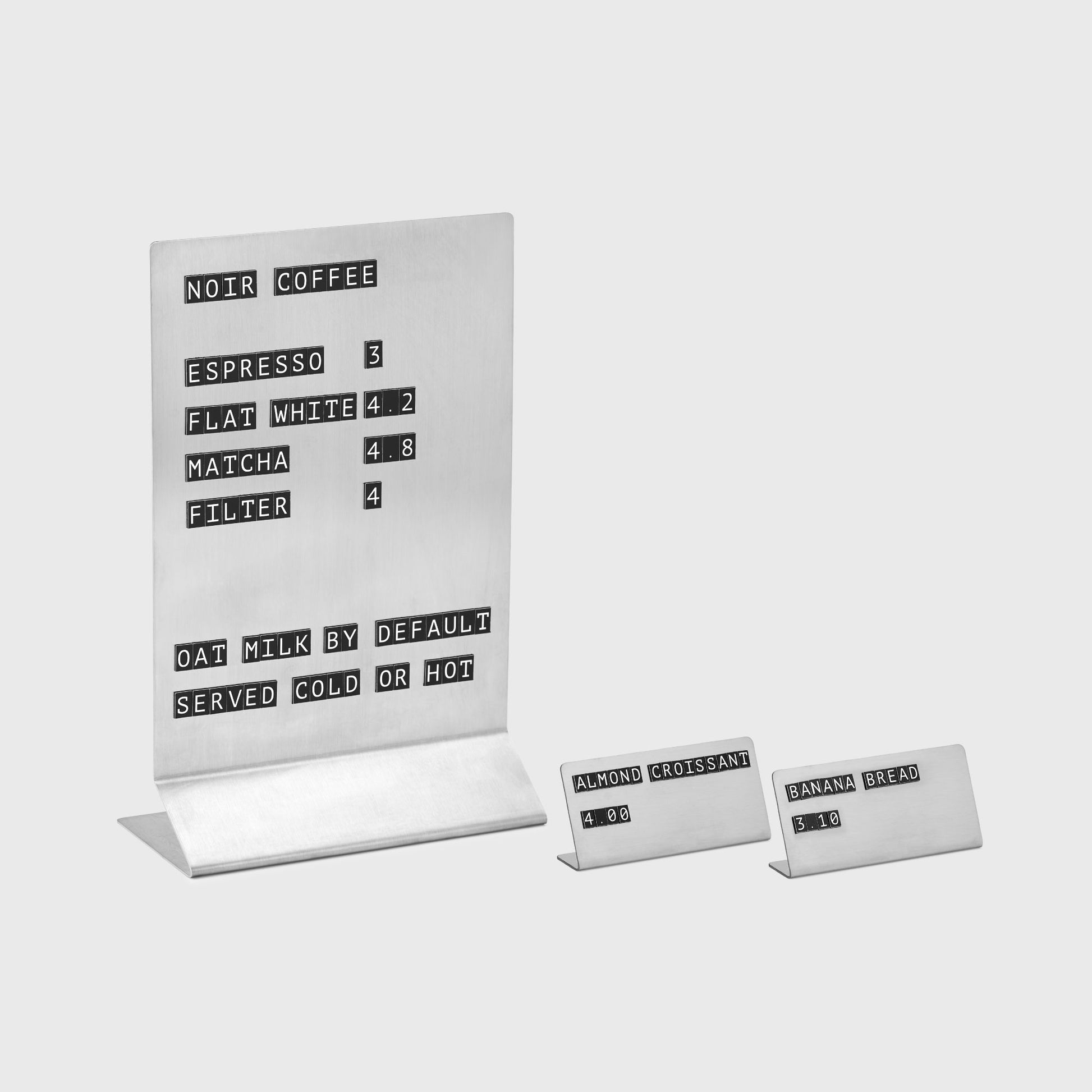 Minimalist table display with detachable magnetic symbols with mini price tags from Stainless steel