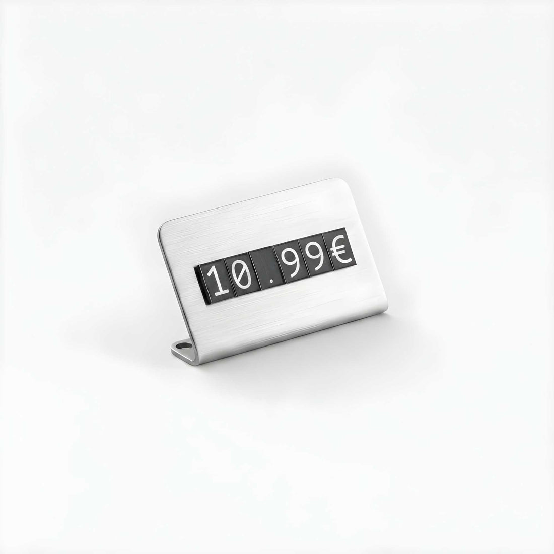A brushed silver metal tabletop price clock showing '10.99€' on black flip-up digits, photographed on a clean white background.