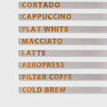 NOKU wall menu set installed in coffee shop interior with wooden magnetic letters in pale wood color

