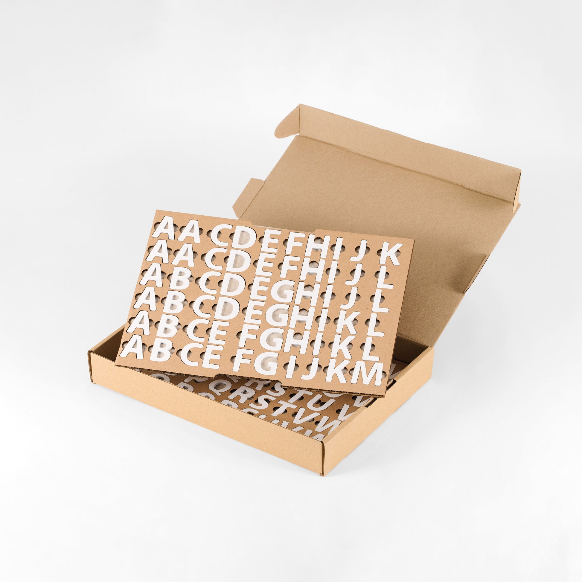 White acrylic magnetic letters packed in the included storage box